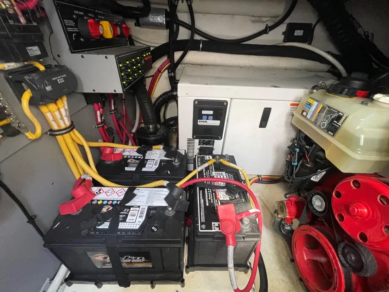Slide: The Image of Engine compartment of a 2016 Monterey 335 Sport Yacht with batteries and wiring. - 26