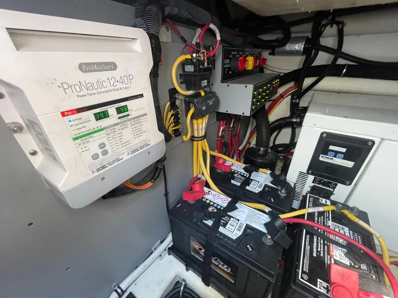 Slide: The Image of Engine compartment of 2016 Monterey 335 Sport Yacht with ProNautic charger and batteries. - 27