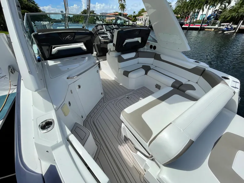 Slide: The Image of 2016 Monterey 335 Sport Yacht interior with sleek seating and modern design. - 4
