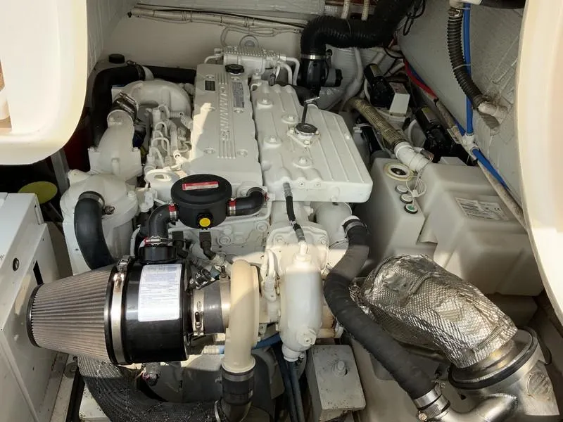 Slide: The Image of Engine compartment of a 2013 Tiara Yachts 36, showcasing detailed mechanical components. - 36