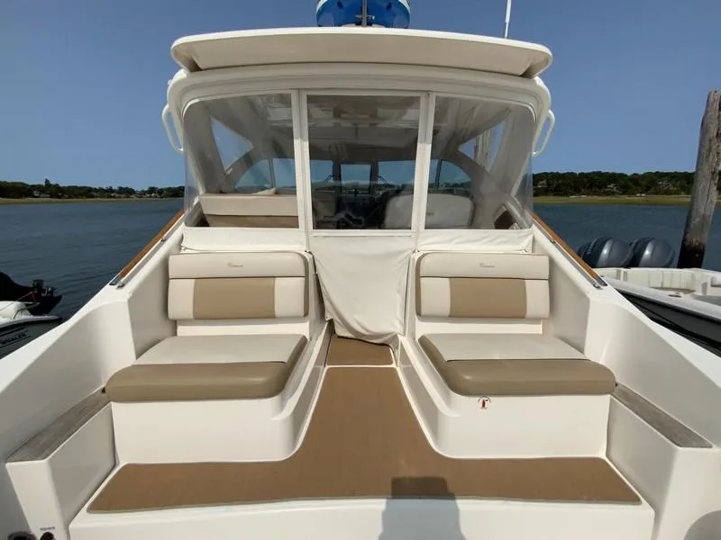 Slide: The Image of 2013 Tiara Yachts 36 with spacious seating and elegant design on the water. - 4