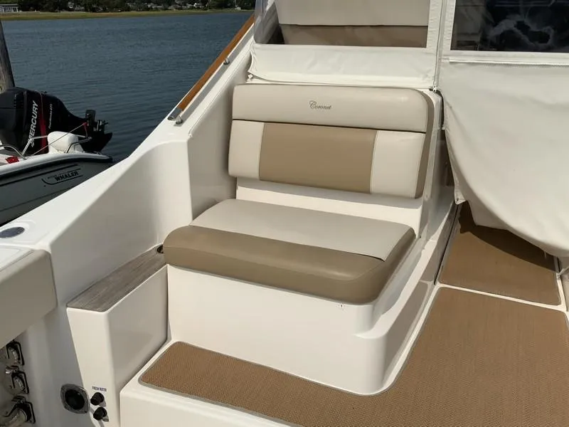 Slide: The Image of Tiara Yachts 36, 2013 model, featuring beige and white seating on deck. - 5