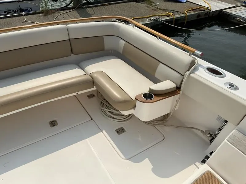 Slide: The Image of Tiara Yachts 36, 2013 model, featuring spacious seating and cup holders on deck. - 8