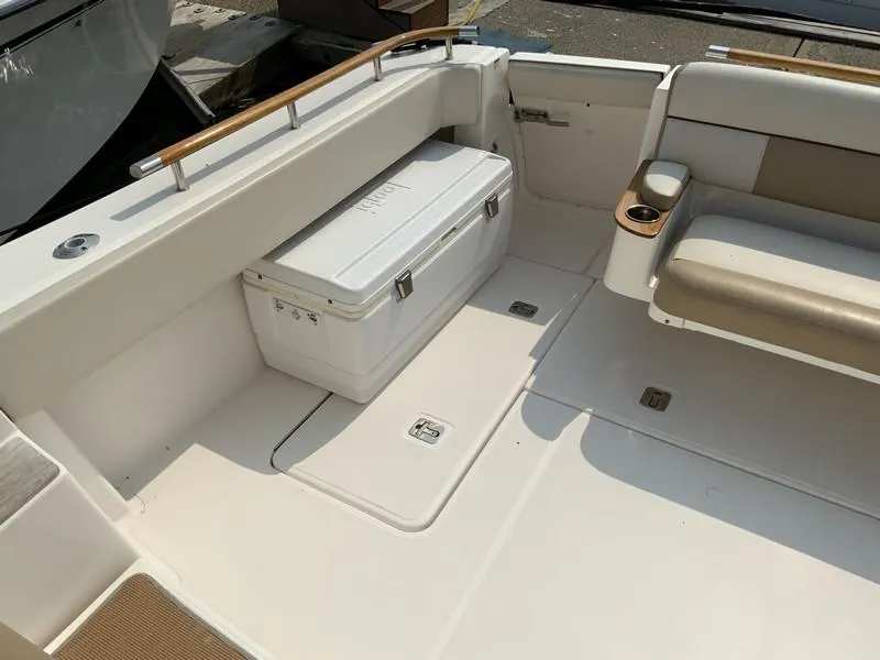 Slide: The Image of 2013 Tiara Yachts 36 interior with seating and cooler in the cockpit area. - 9