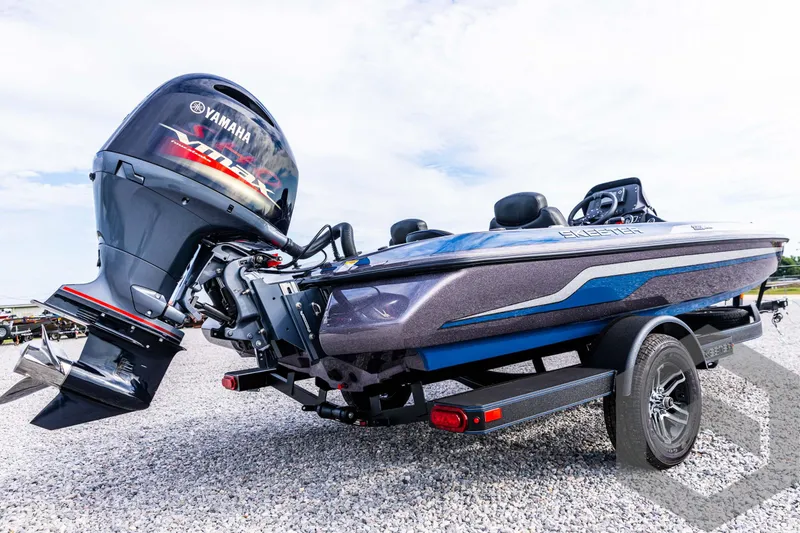 Slide: The Image of 2025 Skeeter ZX 150 boat with Yamaha outboard motor on a trailer. - 14