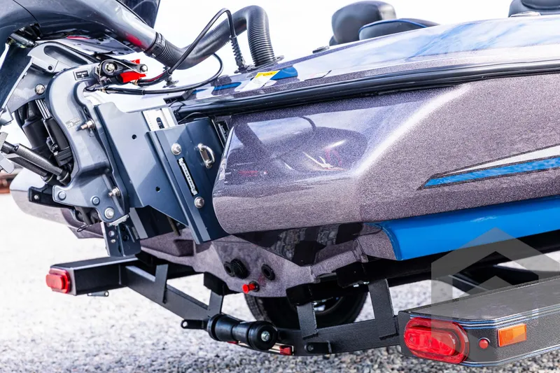 Slide: The Image of 2025 Skeeter ZX 150 boat trailer hitch and motor detail. - 16