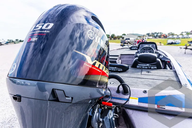 Slide: The Image of 2025 Skeeter ZX 150 boat with Yamaha engine, parked outdoors. - 17