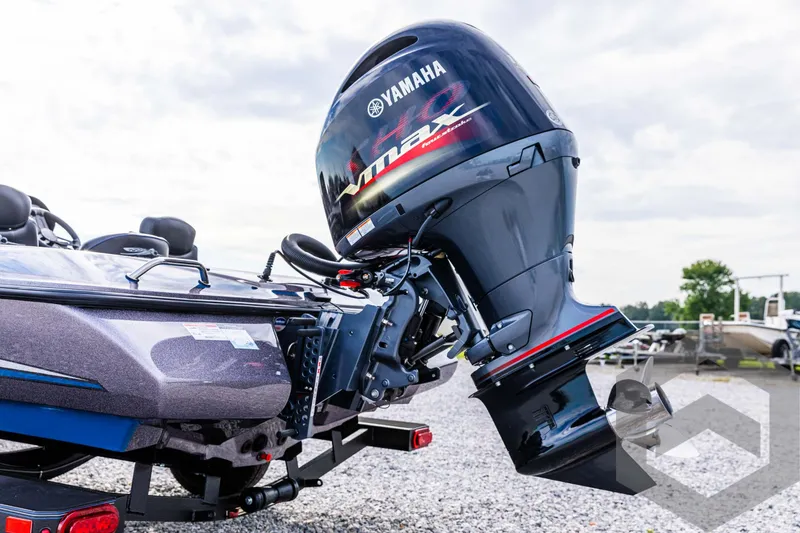 Slide: The Image of 2025 Skeeter ZX 150 boat with Yamaha VMAX outboard motor, parked on gravel. - 21