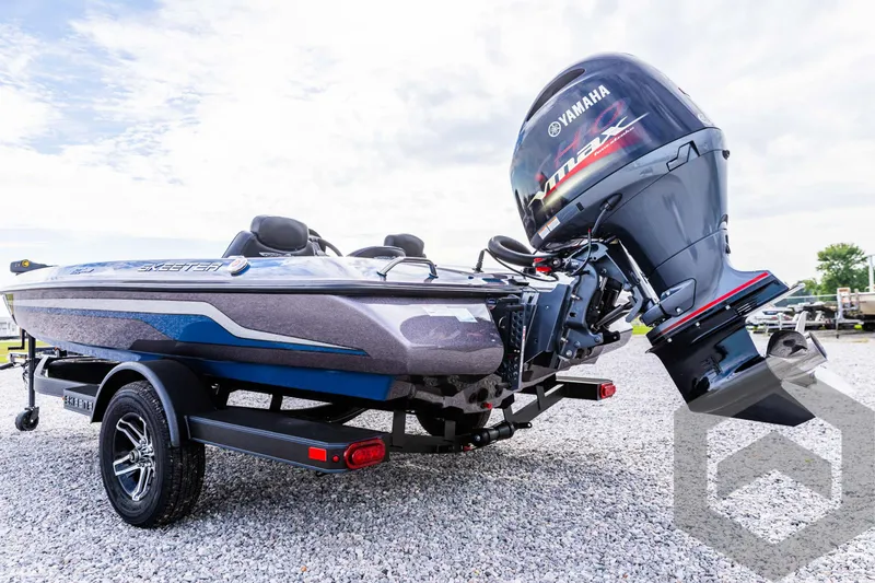 Slide: The Image of 2025 Skeeter ZX 150 boat with Yamaha engine on gravel surface. - 23