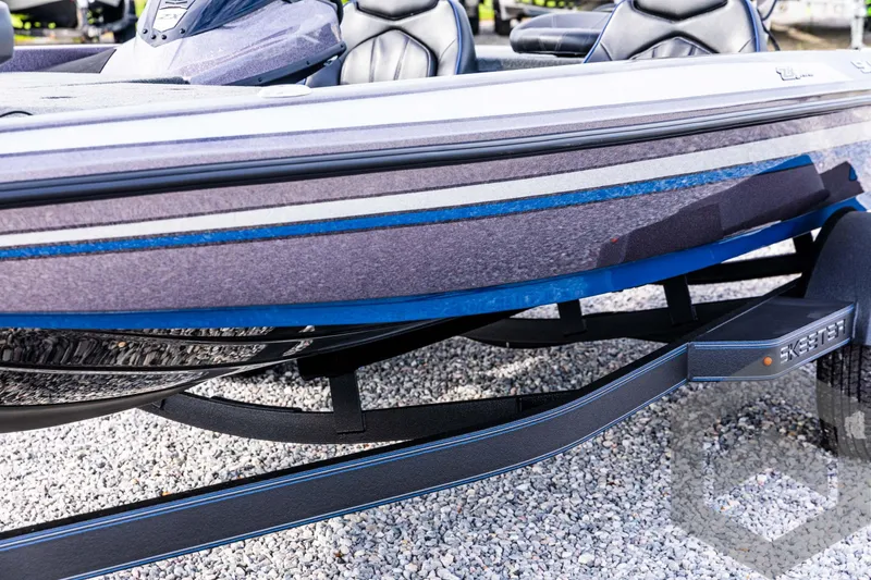 Slide: The Image of 2025 Skeeter ZX 150 boat on trailer, featuring sleek design and blue accents. - 28