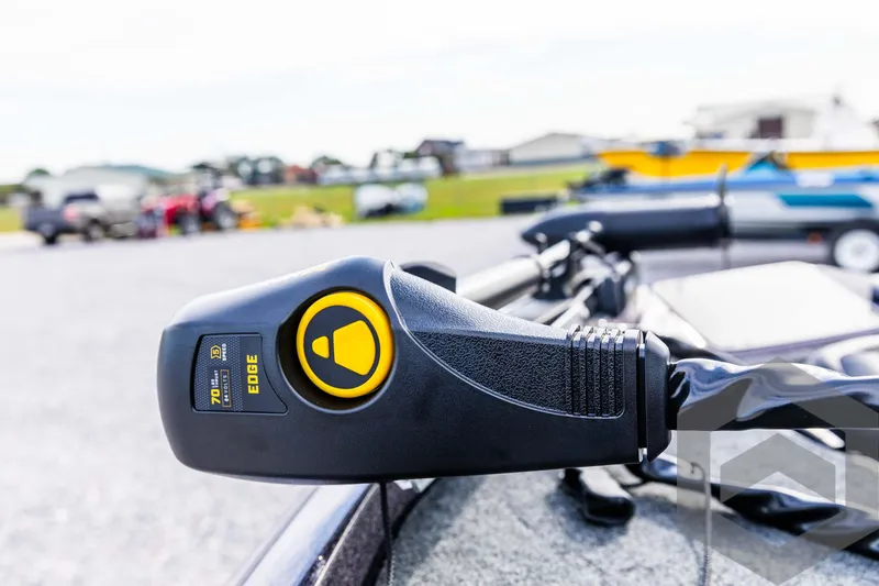 Slide: The Image of Close-up of 2025 Skeeter ZX 150 boat control panel in a parking lot. - 31