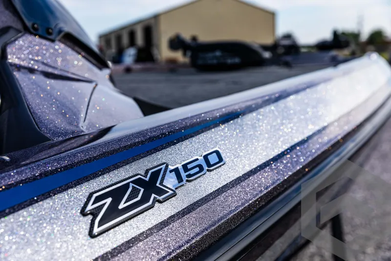 Slide: The Image of 2025 Skeeter ZX 150 boat with sleek design and metallic finish. - 32