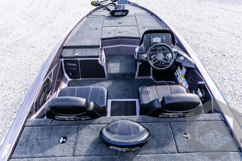 Slide: The Image of 2025 Skeeter ZX 150 boat interior with modern dashboard and seating. - 39