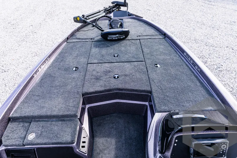 Slide: The Image of 2025 Skeeter ZX 150 boat deck with storage compartments and trolling motor. - 40