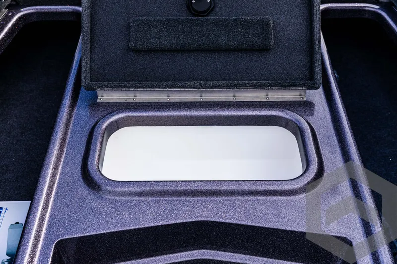 Slide: The Image of 2025 Skeeter ZX 150 boat storage compartment with open lid. - 47