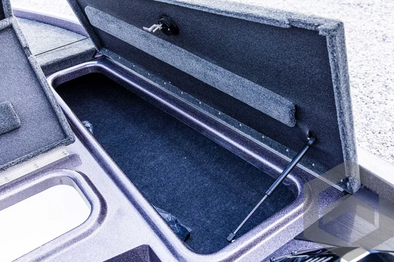 Slide: The Image of Open storage compartment in 2025 Skeeter ZX 150 boat. - 48