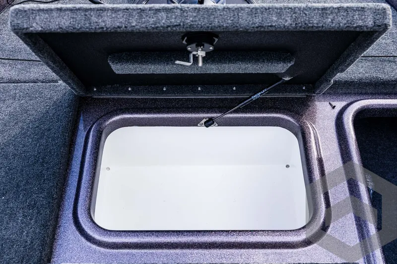 Slide: The Image of Open storage compartment in 2025 Skeeter ZX 150 boat. - 49