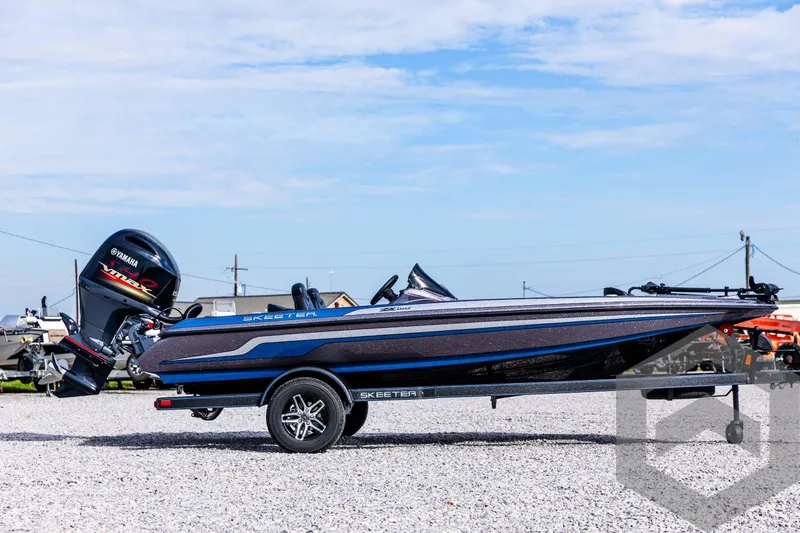 Slide: The Image of 2025 Skeeter ZX 150 boat with Yamaha outboard motor on gravel lot. - 5