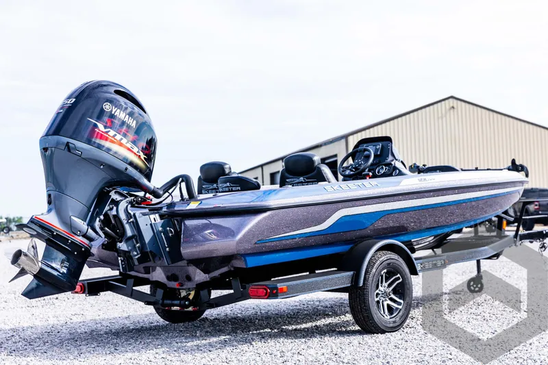 Slide: The Image of 2025 Skeeter ZX 150 boat with Yamaha engine on trailer, parked outdoors. - 6