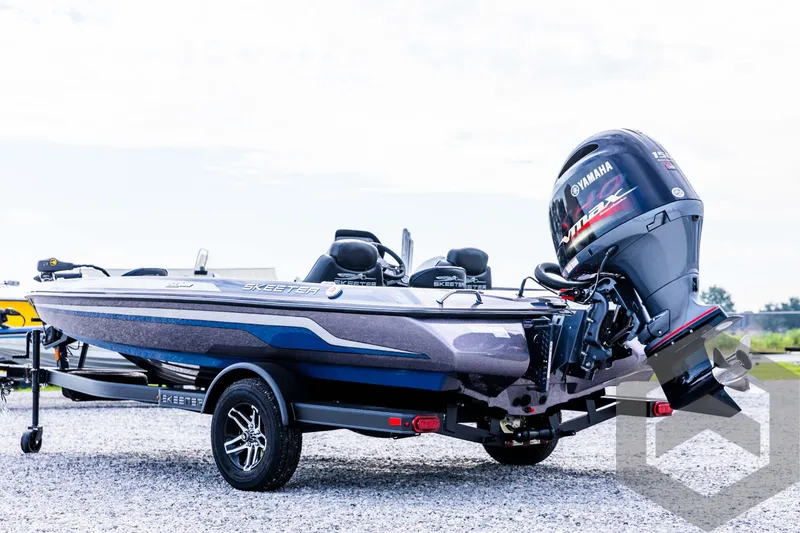Slide: The Image of 2025 Skeeter ZX 150 boat with Yamaha outboard motor on a trailer. - 8