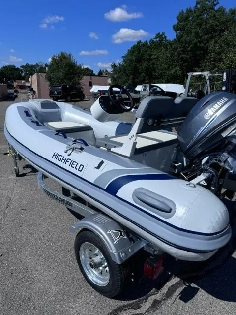 Slide: The Image of 2024 Highfield Classic 310 FCT inflatable boat on trailer, featuring Yamaha outboard motor. - 8