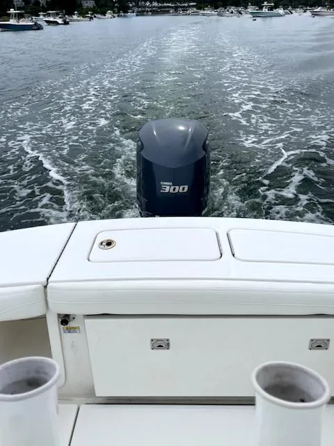 Slide: The Image of 2020 Regulator 23 FS boat with 300 horsepower engine cruising on water. - 10