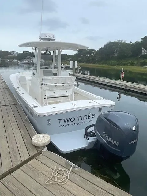 Slide: The Image of 2020 Regulator 23 FS boat docked, featuring Yamaha 300 engine, named "Two Tides." - 3
