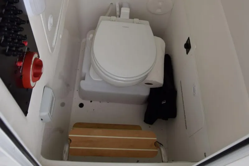 Slide: The Image of 2020 Regulator 23 FS boat interior with compact marine toilet. - 7