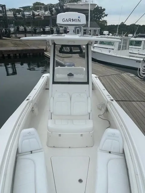 Slide: The Image of 2020 Regulator 23 FS boat with Garmin equipment docked at marina. - 9