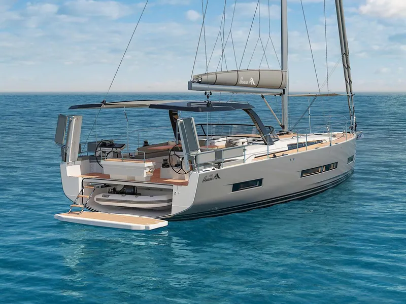 Slide: The Image of 2025 Hanse 590 yacht sailing on clear blue ocean waters. - 1
