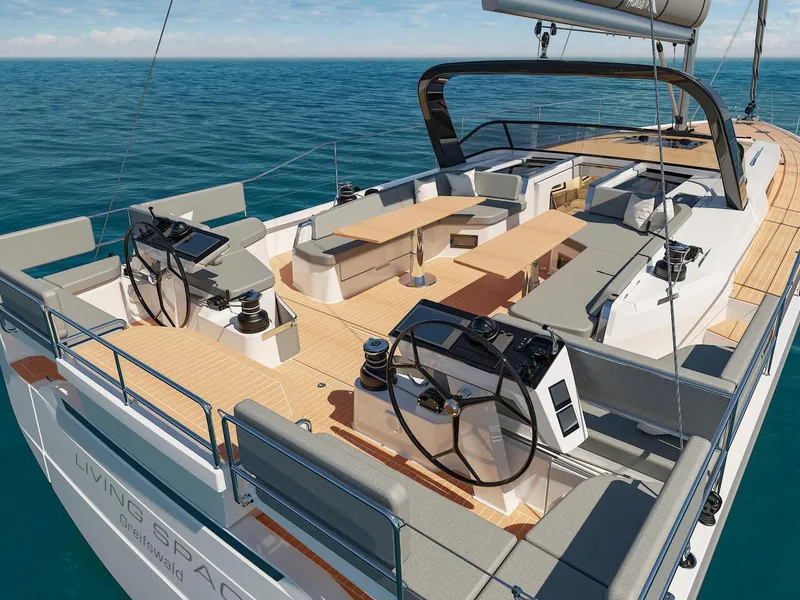 Slide: The Image of 2025 Hanse 590 yacht with spacious deck and dual steering wheels on open sea. - 10