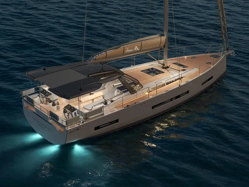 Slide: The Image of Luxurious 2025 Hanse 590 yacht illuminated on calm waters at dusk. - 23