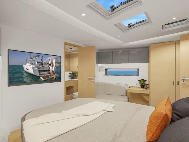 Slide: The Image of Luxurious 2025 Hanse 590 yacht cabin with modern decor and skylights. - 42