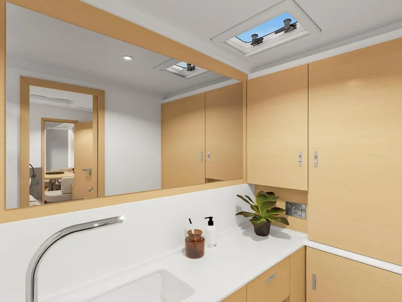 Slide: The Image of Modern bathroom interior on 2025 Hanse 590 yacht, featuring sleek cabinetry and skylight. - 45