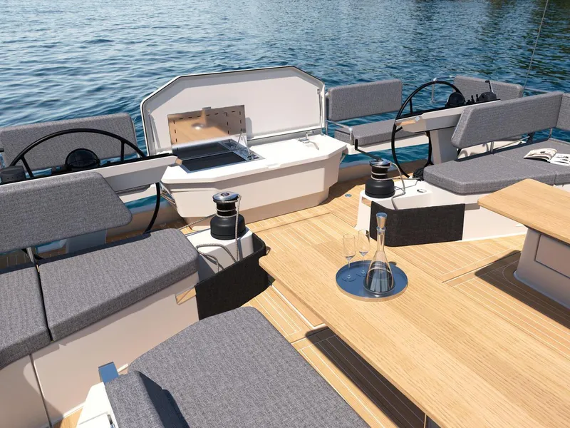 Slide: The Image of Luxury Hanse 590 yacht deck with seating, table, and ocean view, 2025 model. - 8
