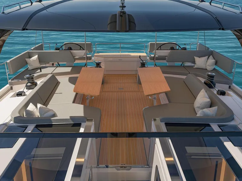 Slide: The Image of Luxurious 2025 Hanse 590 yacht deck with elegant seating and tables, overlooking the ocean. - 9