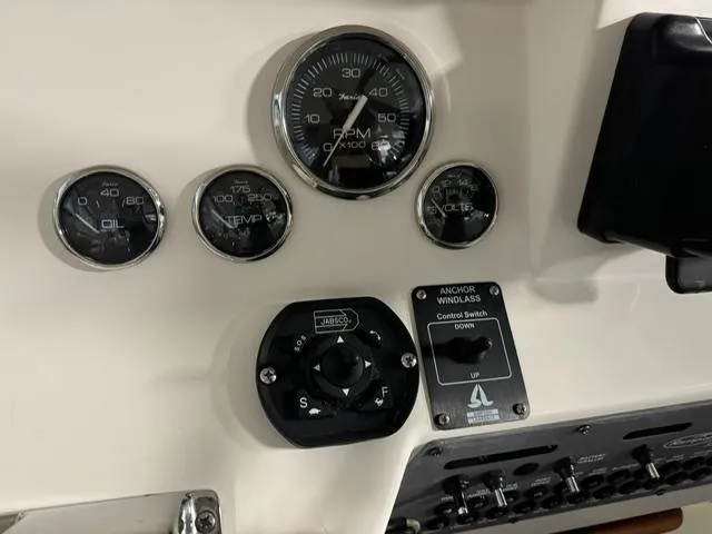 Slide: The Image of 2006 Rampage 33 Express dashboard with gauges and anchor windlass control. - 14