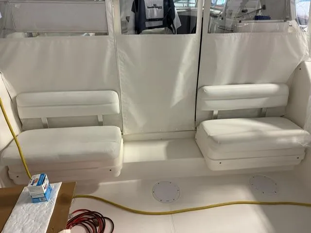 Slide: The Image of Interior of 2006 Rampage 33 Express boat with white seating and clean design. - 5