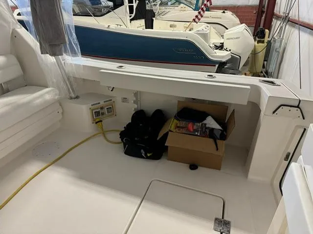 Slide: The Image of 2006 Rampage 33 Express boat interior with storage box and equipment. - 6