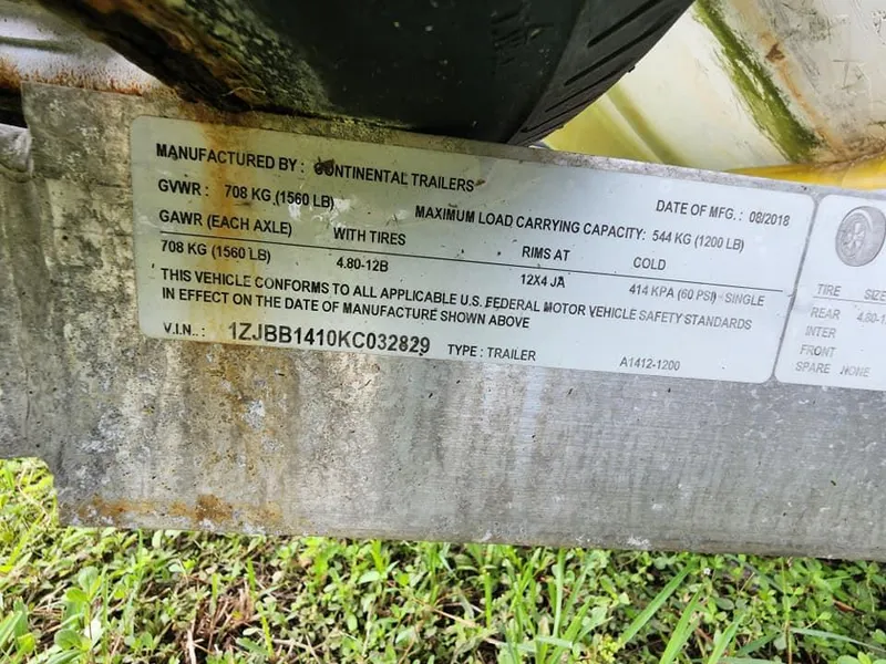 Slide: The Image of Trailer label showing specifications and VIN for a 2000 Boston Whaler Sport 13. - 10