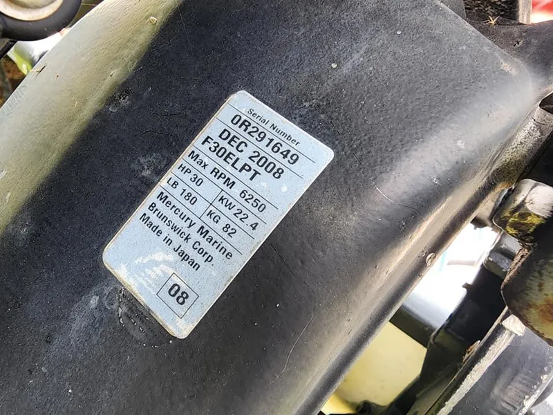 Slide: The Image of Label on a 2000 Boston Whaler Sport 13 engine, showing serial number and specifications. - 3