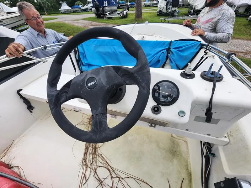 Slide: The Image of Boston Whaler Sport 13 boat interior with steering wheel and dashboard, 2000 model. - 6