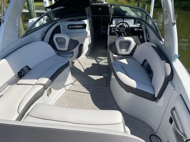 Slide: The Image of 2023 Crownline 290 XSS boat interior with luxurious seating and modern design. - 19