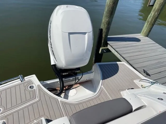 Slide: The Image of 2023 Crownline 290 XSS boat with outboard motor at dock. - 20