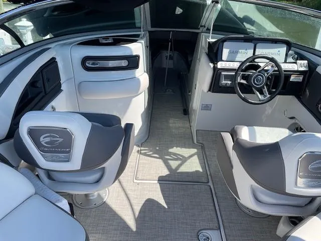 Slide: The Image of 2023 Crownline 290 XSS boat interior with modern helm and seating. - 26