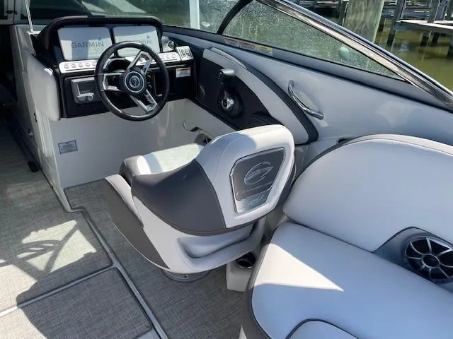 Slide: The Image of 2023 Crownline 290 XSS boat interior with modern helm and seating. - 27