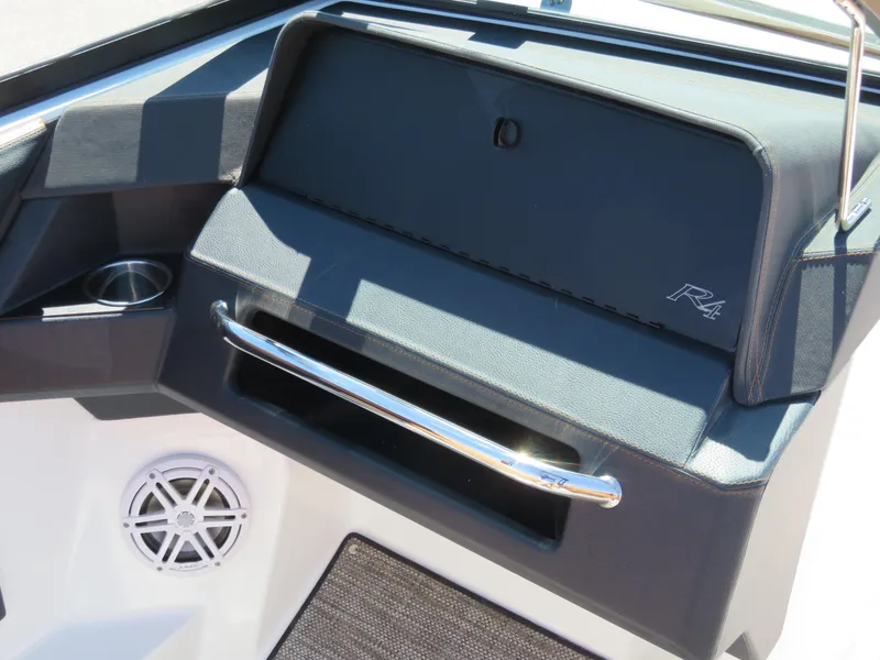 Slide: The Image of 2024 Cobalt R4 boat dashboard with speaker and storage compartment. - 10