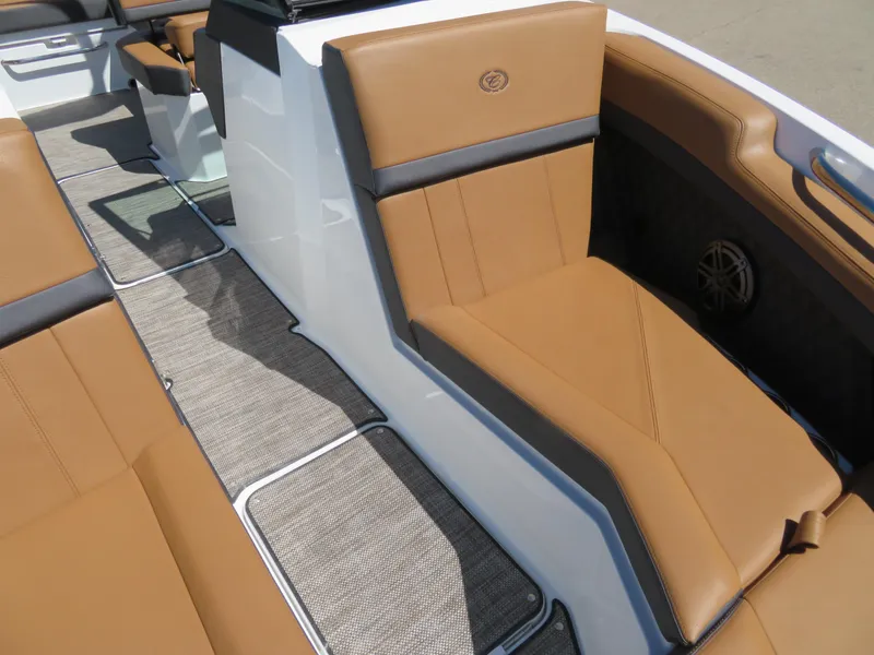 Slide: The Image of 2024 Cobalt R4 boat interior with tan leather seating and modern design. - 11