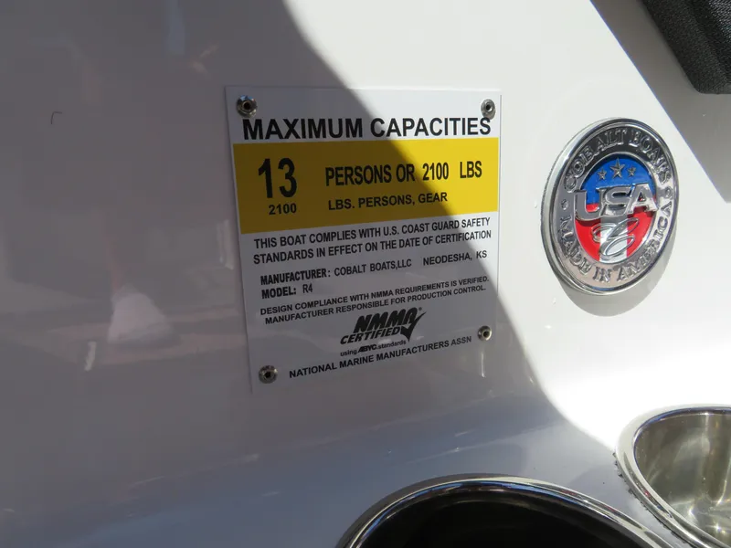 Slide: The Image of 2024 Cobalt R4 boat capacity label, maximum 13 persons or 2100 lbs. - 13