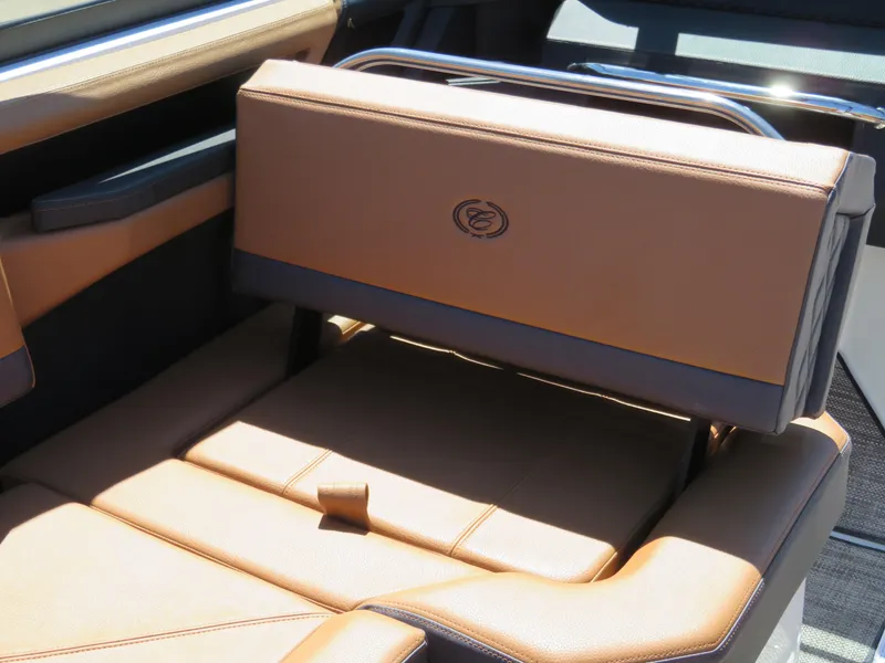Slide: The Image of 2024 Cobalt R4 boat interior with luxurious tan leather seating. - 14